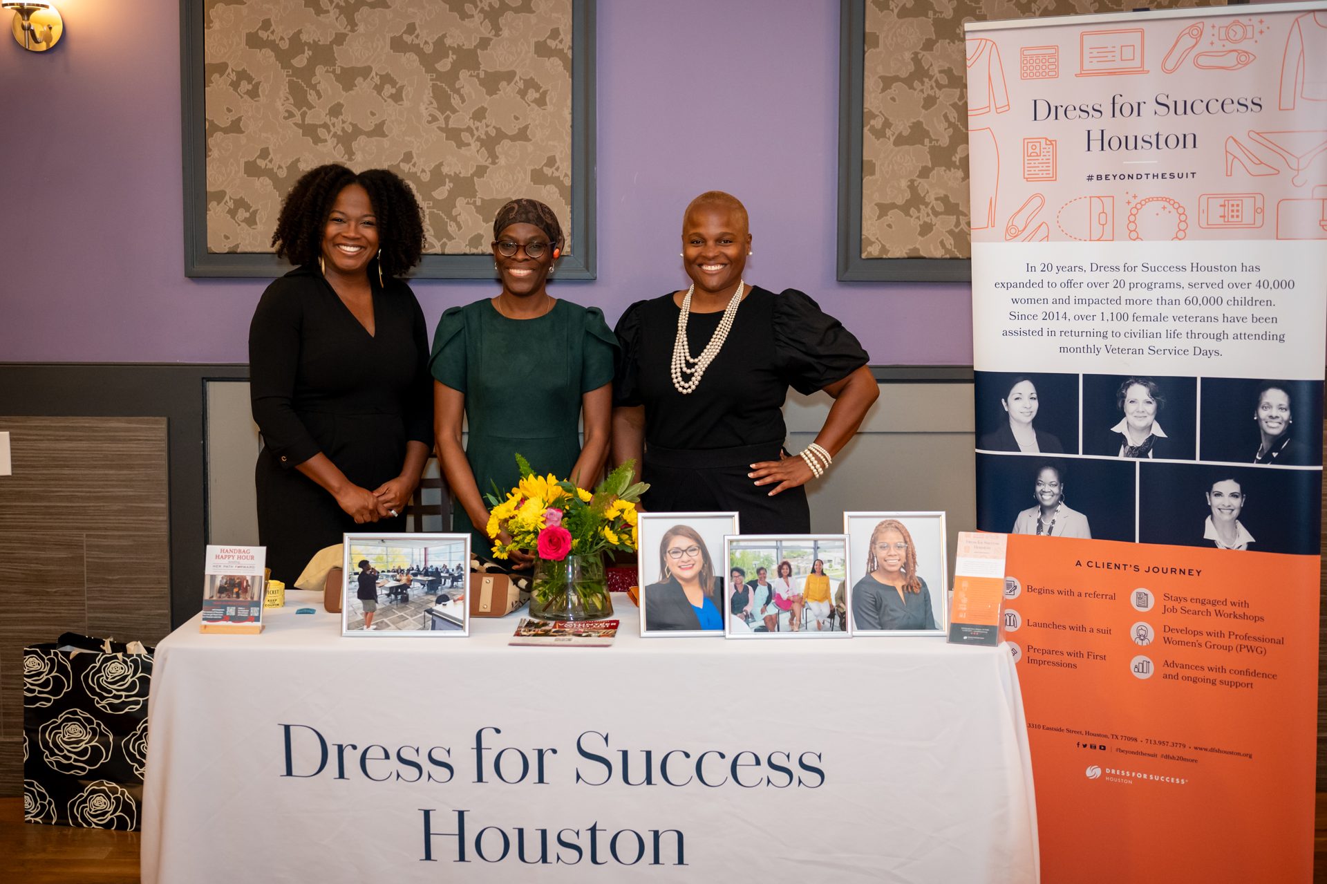 Dress for Success Houston team at their table at a Women Driving Business event