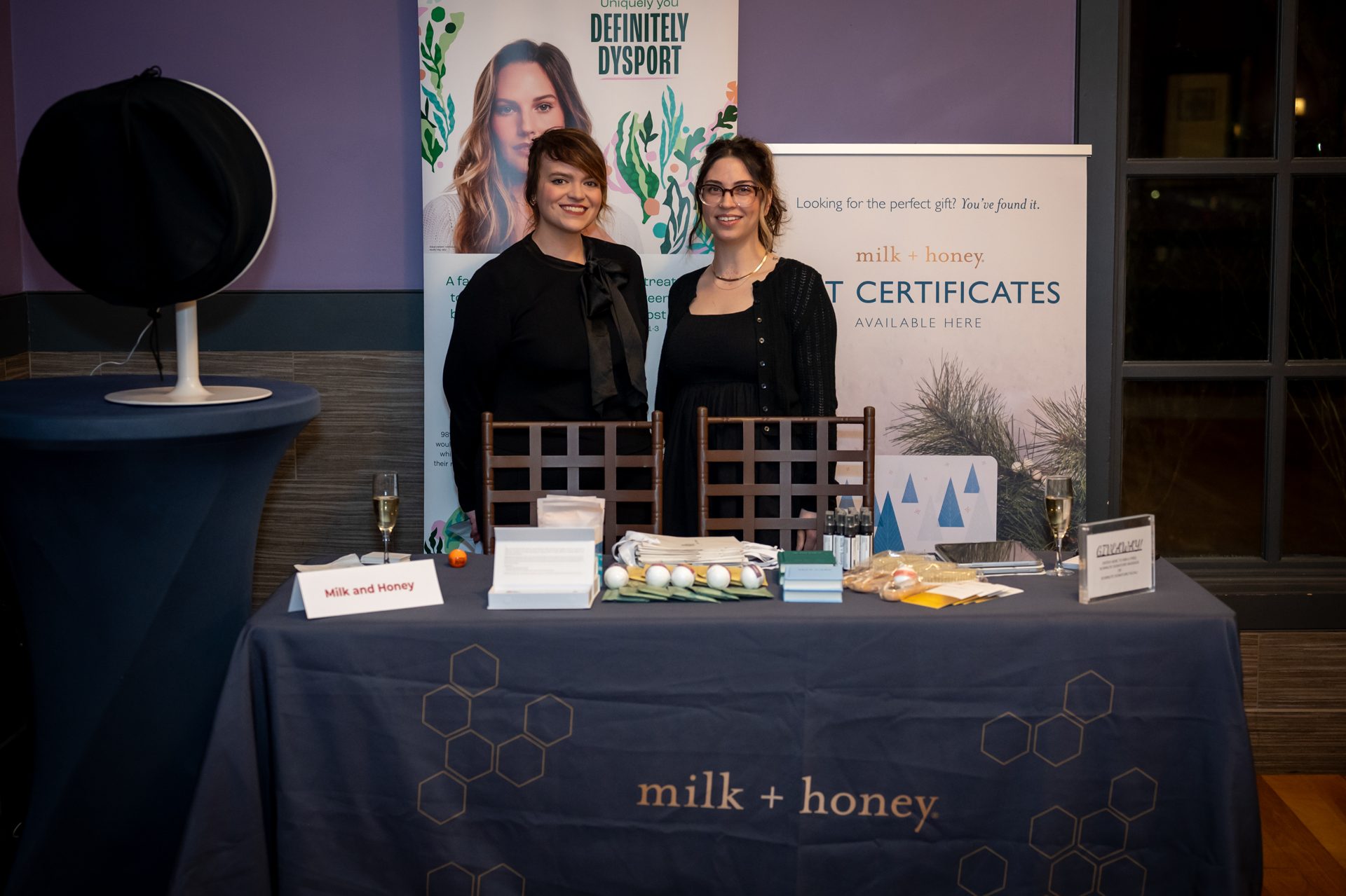 milk + honey spa vendor table at a Women Driving Business event in west Houston